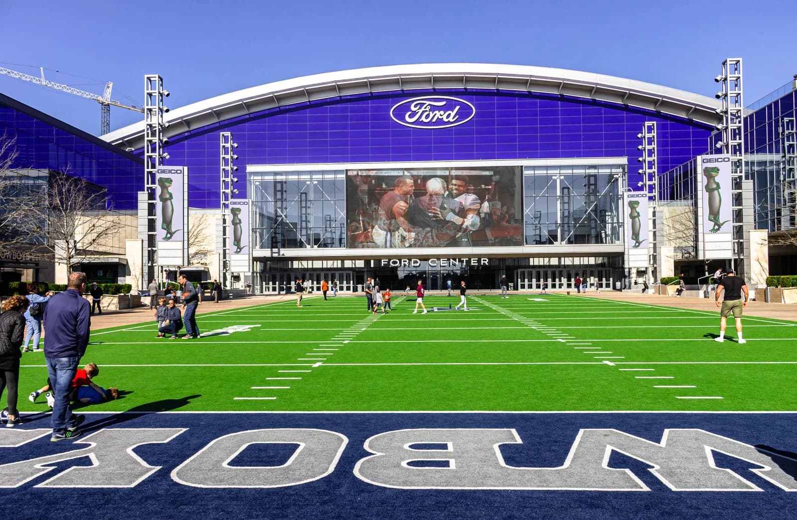 A lively scene at the Ford Center sports venue with people enjoying the outdoors.