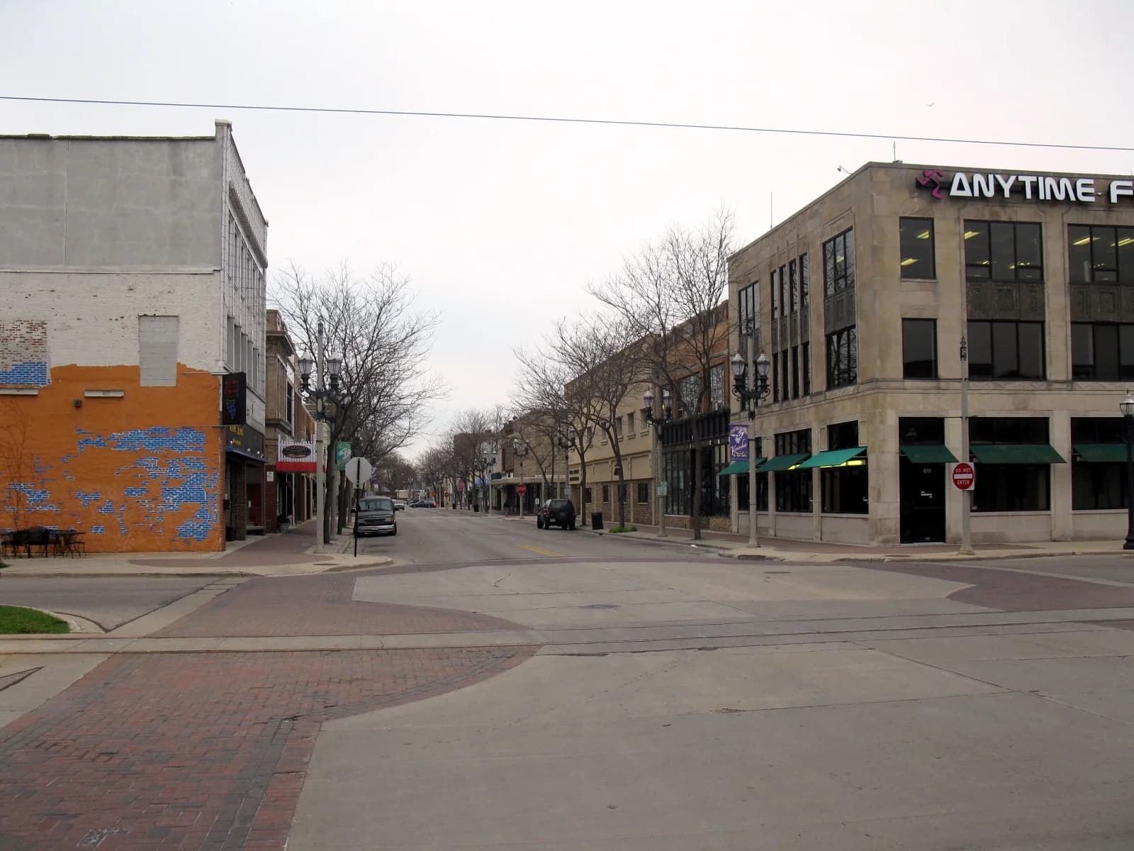 A downtown Kenosha, Wisconsin street corner with streetcar tracks running through the intersection