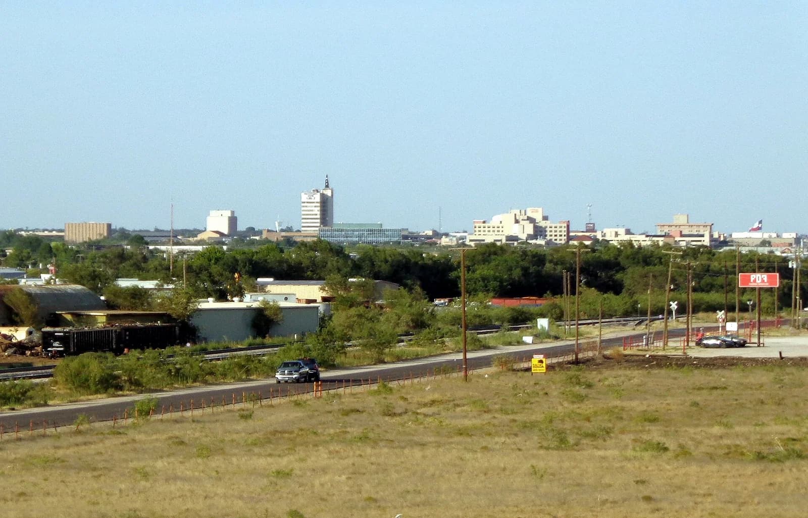 The downtown Odessa, Texas skyline seen across the rail yard