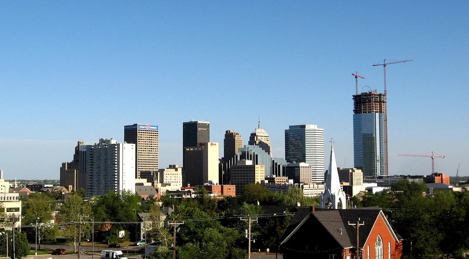 The downtown Oklahoma City skyline seen from the south with Devon Tower under construction