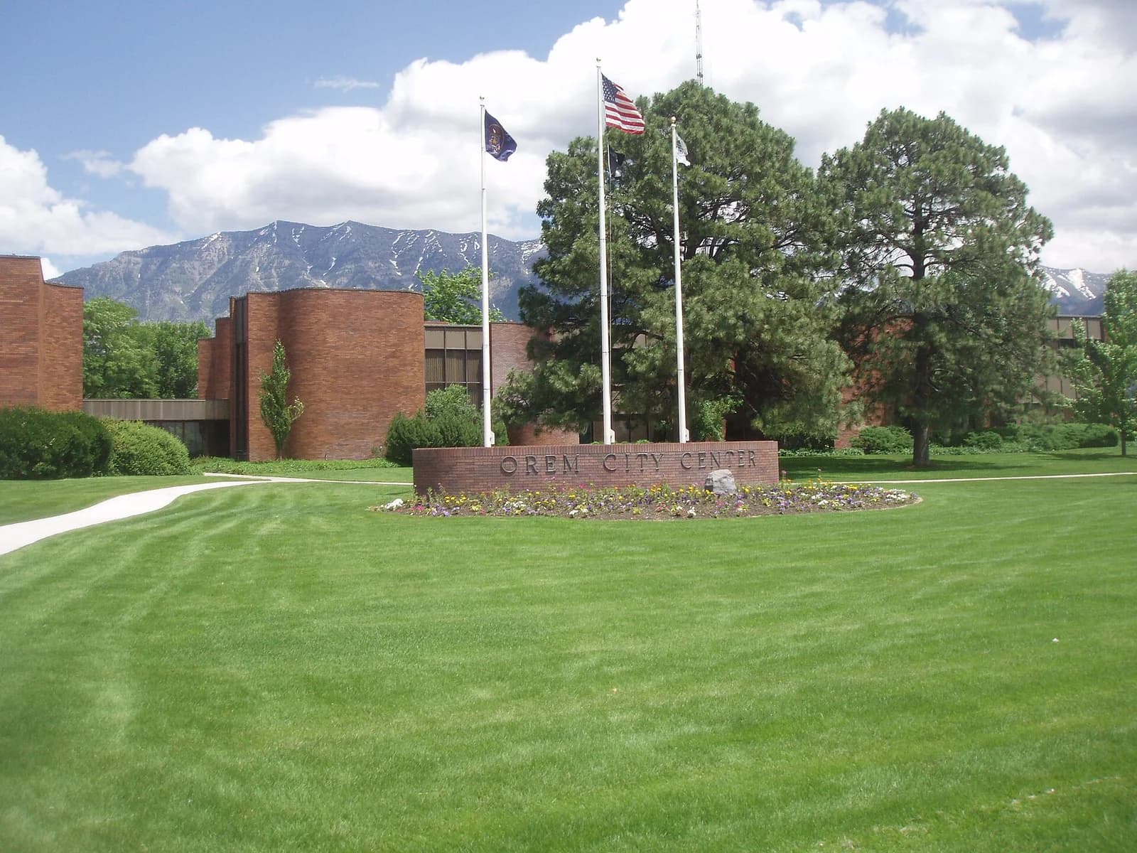 The Orem City Center sign in Orem, Utah with the Wasatch mountains behind it