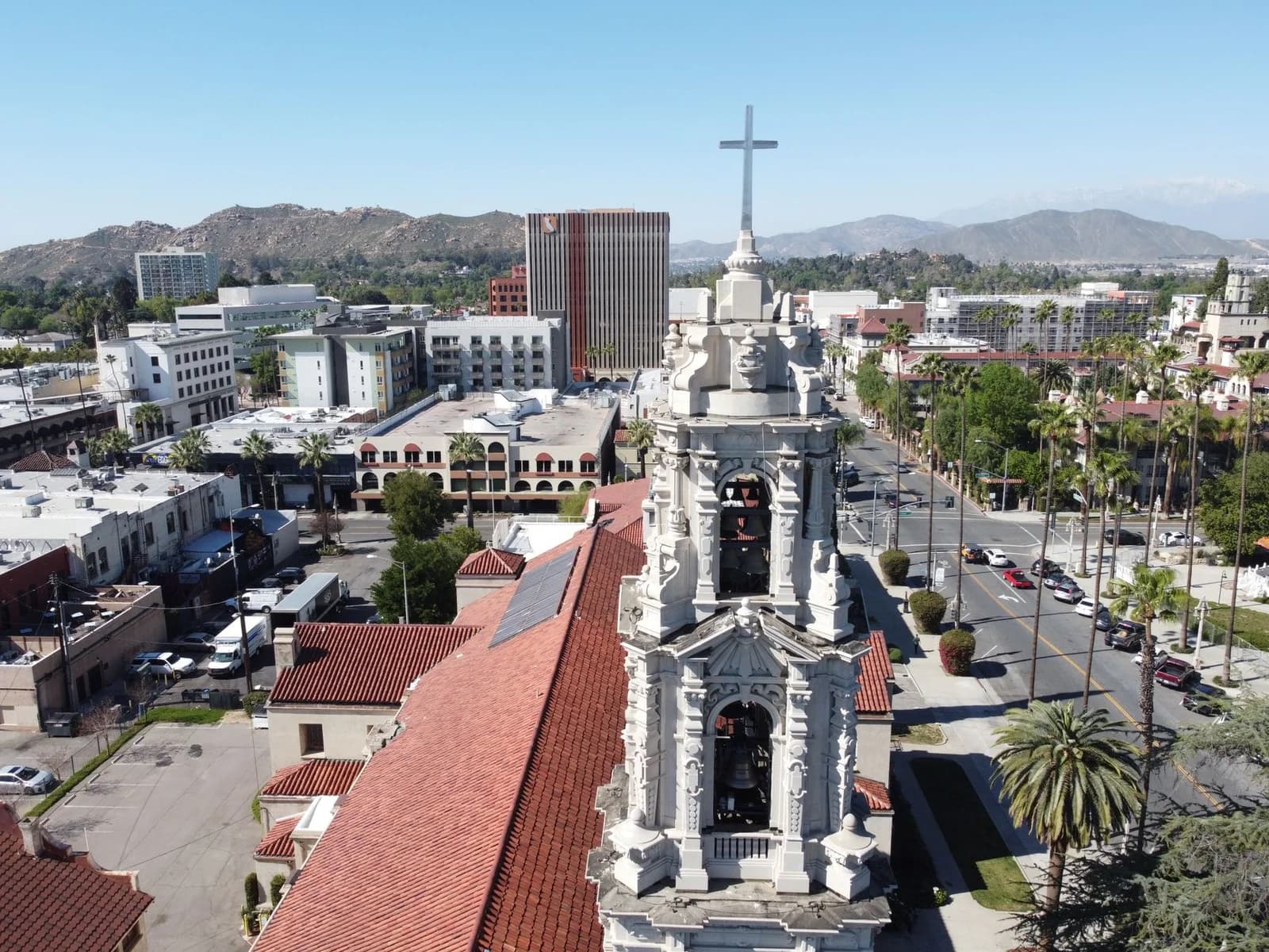 Explore a stunning aerial shot of Downtown Riverside, CA, featuring a historic cathedral.