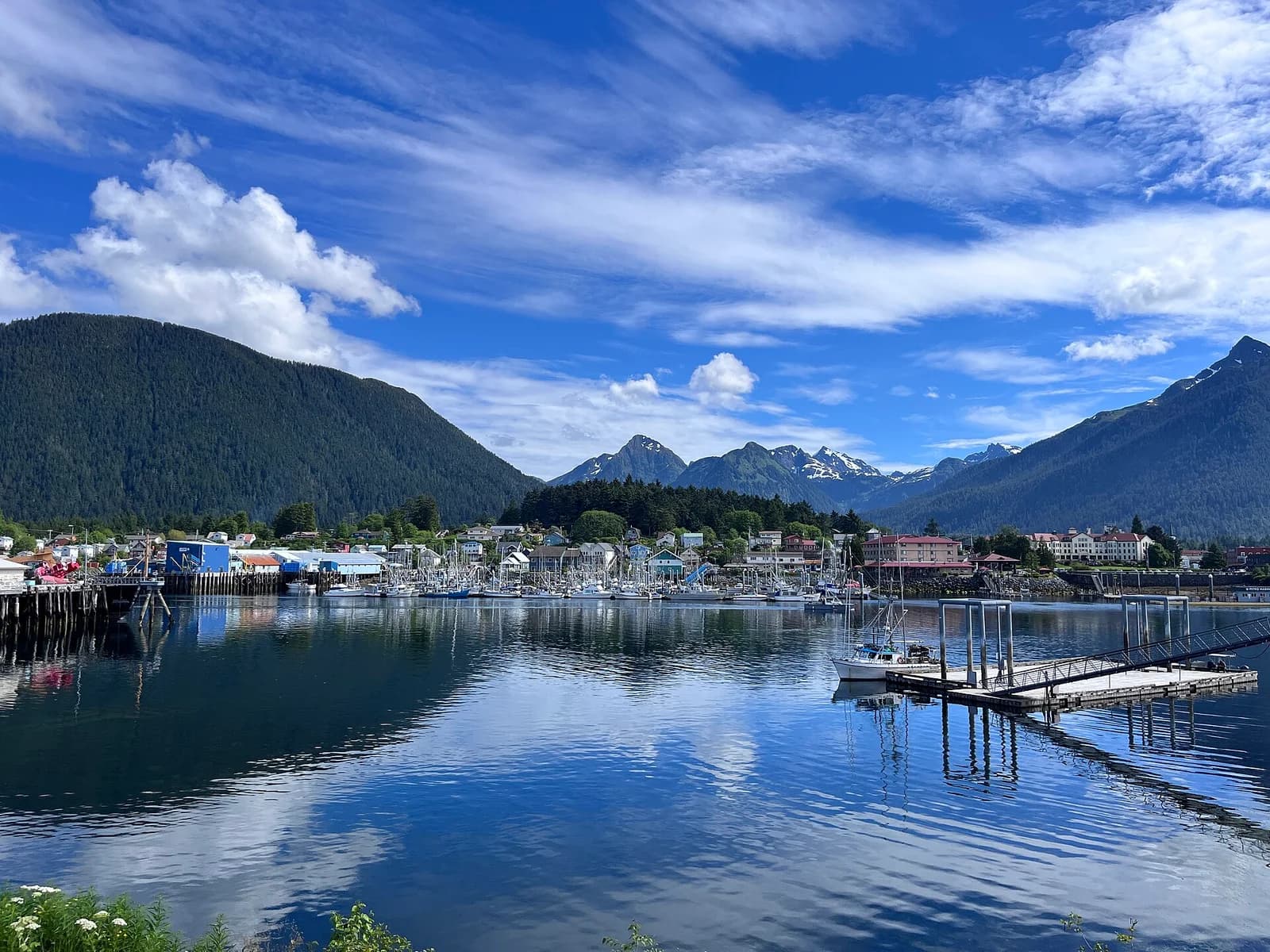 Sitka, Alaska harbor with the fishing fleet moored below the snow-capped Baranof Island peaks