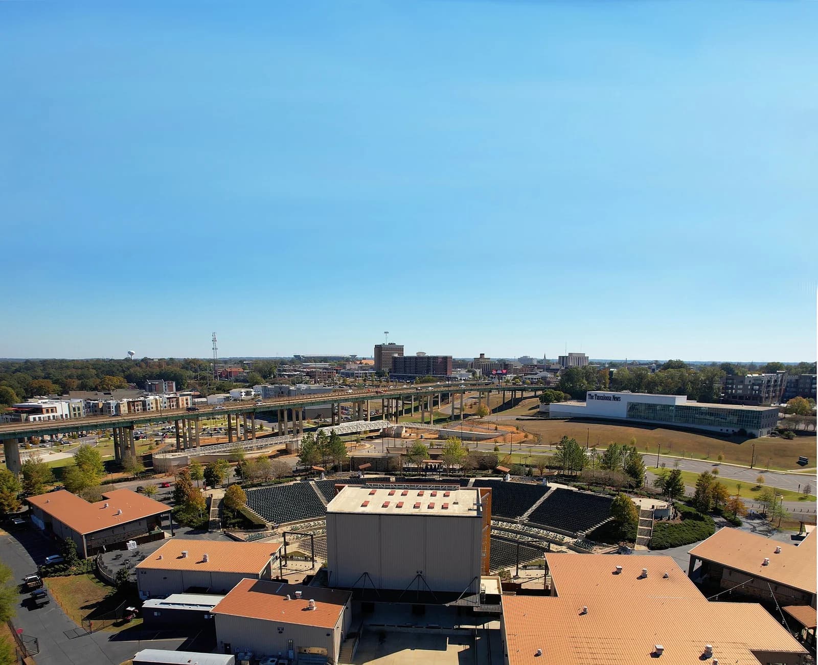 Aerial view of downtown Tuscaloosa, Alabama with the riverfront amphitheater in the foreground