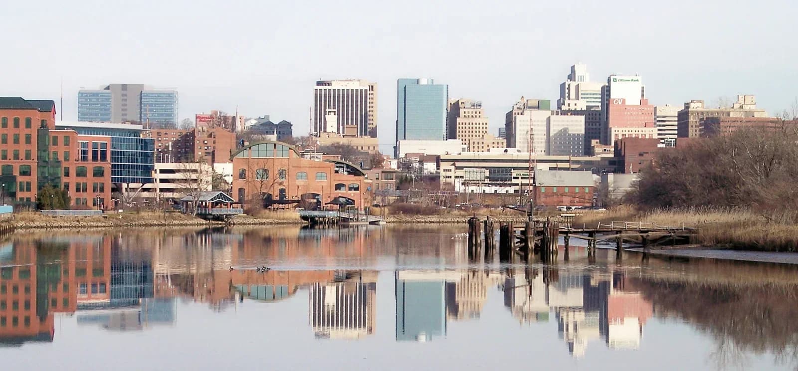 Wilmington Delaware downtown skyline reflected in the Christina River, with the Nemours Building and financial district