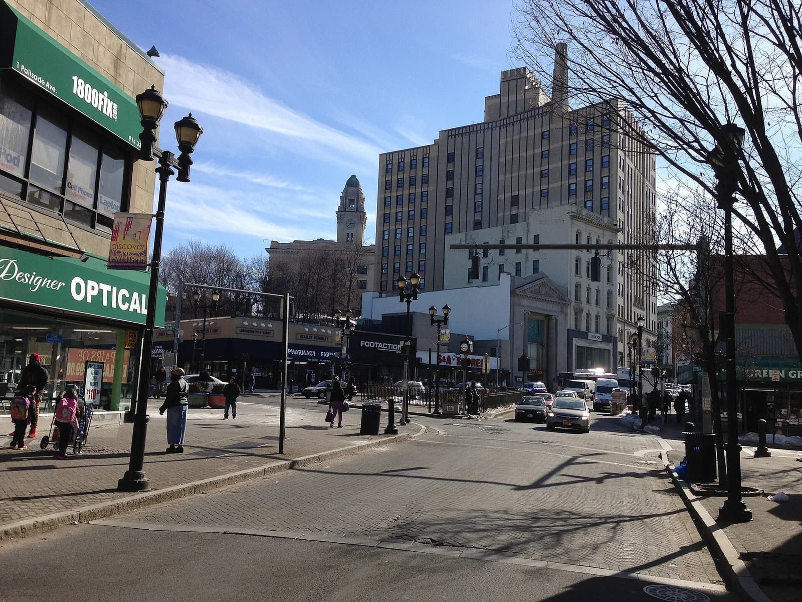 Getty Square in downtown Yonkers, New York with City Hall's clock tower rising behind the storefronts