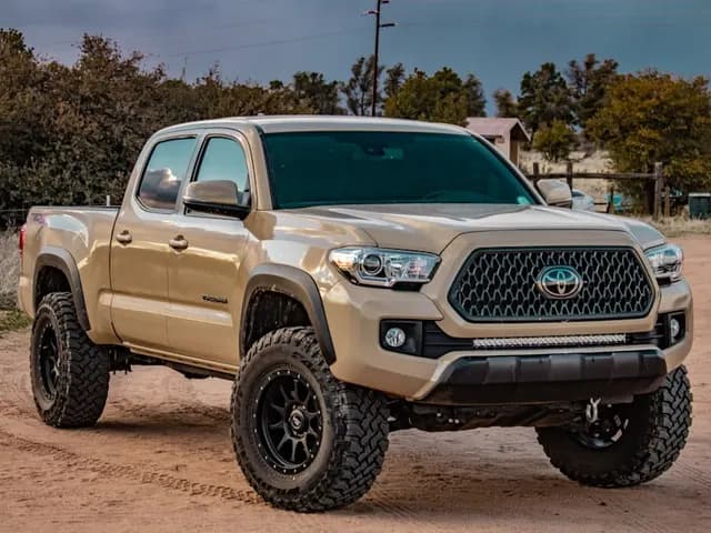 A white crew-cab pickup truck